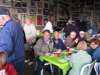  - Pat Quinn Bucker Museum Hangar with host Pat and Arlys standing behind, at his great barbecue luncheon with many friends gathered for his FAA Award ceremony-Wright Bros. Master Pilot Award for 50 years accident free-no violations flying. - by Doug Robertson