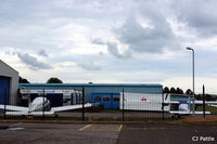  - Through the fence glance at the Tayside Aviation HQ at Dundee Riverside Airport EGPN - by Clive Pattle
