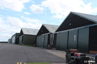  - A view of the many hangars at The Shuttleworth Trust, Old Warden Airfield, each filled with aviation gems. - by Clive Pattle