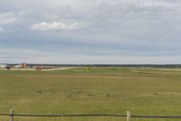  @ CFX4 - Manning Municipal Airport, Alberta, Canada. View to west of airstrip and apron from highway. - by Remi Farvacque