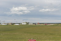  @ CFX4 - Manning Municipal Airport, Alberta, Canada. View to west from highway of building and hangars. - by Remi Farvacque