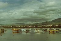  @ Q59 - Fremont airport,Calif during one of its many floods and Carl seen in front of his yellow Stinson doing everything he could (raised plane etc) to protect his pride & joy.Few owners I knew cared more for their planes then Carl did.View is NE. - by S B J