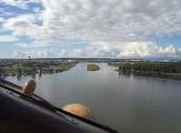 - 1958 DeHavilland BEAVER DHC-2 MK.1, P&W R-985 450 Hp, turning on final for landing left water lane-Lake Hood SPB, AK. Note: ANC Tower left horizon. In 1939 USA Corps of Engineers dredged between Lakes Hood & Spenard to form LHD-SPB, World's Largest! - by Doug Robertson