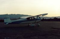  - 69E with the small villiage of Stovepipe Wells seen in the distance. Short  walk and on one of my visits, 7-8 older people walked over for their early am walk.Nice to have an audience for my take off?? Hope there was no pilots among them. - by S B J