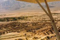  - Furnace Creek looking to the SW. Airport is seen at the top of the wing strut. - by S B J