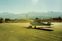  - 78E at Bridgeport,Ca with the Walker River Lodge seen in the distance.Nice place to stay and its neat to look out and see your plane. Notice the six vehicles that pilots leave so they will have transportation when they fly in.Nice! - by S B J
