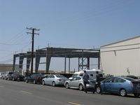  - New EAA Chapter 723 large hangar under construction adjacent present CAF hangars extends from street to taxiway. On site former EAA Chapter 723 much smaller hangars. Street view. - by Doug Robertson