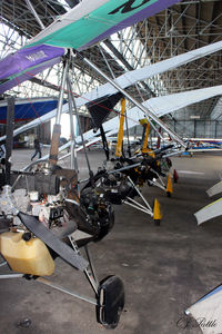  - A clump of microlights hangared at Perth (Scone) EGPT - note the WWII built trellis construction of the hangar roof. - by Clive Pattle