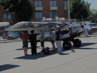  - 2014 Air Race Classic officials check out Aviat A-1C-200 N462WC #23 on the flightline prior to the cross country race. Everything was OK! - by Steve Nation