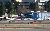  - Pacific States Aviation offices, hangar and showroom @ Buchanan Field, Concord, CA on a windy January day (Hughes 369 hovering in foreground was with Bristow Academy) - by Steve Nation