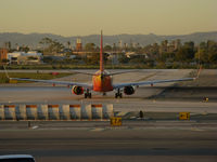  - Southwest Airlines 737-700 in old colors taxiing for takeoff @ Los Angeles International Airport, CA - by Steve Nation
