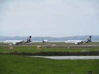  - ZK-OXJ and OXF queuing to leave with OXI just landing in between. View from public lay-by off Puhinui Road. - by magnaman