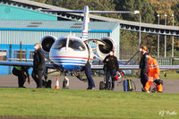  - Groundcrew retrieve chocks whilst passengers and crew load onto a visiting LJ31A at Dundee Riverside Airport EGPN - by Clive Pattle