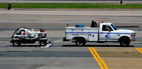 @ Ronald Reagan Washington National Airport - Truck 4 towing fuel pump at National - by Ronald Barker