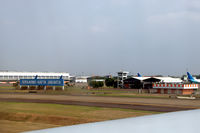  - The big blue sign leaves no doubt about which airport this is. - by Van Propeller