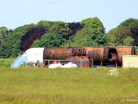  - Fire training area at Humberside EGNJ - note BAC 1-11 510ED G-AVMP fuselage in rear. - by Clive Pattle
