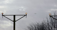  - Runway 23 approach lighting view at Glasgow International Airport EGPF - note Scottish Ambulance Beech King Air G-SASC departing in the distance - by Clive Pattle