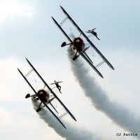  - Two (unidentified) Boeing Stearmans of the Breitling Wingwalkers displaying at the Heart of Scotland Airshow at Perth airfield EGPT - by Clive Pattle