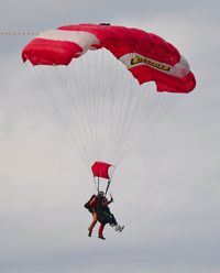  - Tandem skydivers from Skydive Swansea dropping in from 12000 feet - by Roger Winser