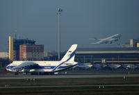  - View to apron 3 with AN 124 while a triple seven of AeroLogic is leaving westbound on rwy 26L.... - by Holger Zengler