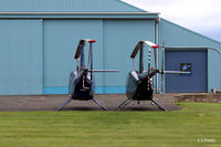  - Specialist Helicopters Ltd R44's parked outside their hangar at Perth EGPT - by Clive Pattle