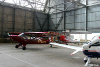  - General internal hangar view at Perth EGPT, highlighting the 1938 WWII roof construction, maximising on light. - by Clive Pattle