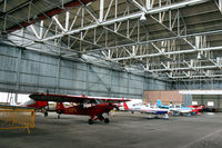  - General internal hangar view at Perth EGPT, highlighting the 1938 WWII roof construction, maximising on light. - by Clive Pattle