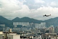  - JAL DC-8-50 landing at HKG,1979.
Although strictly not an airport photo,I decided to add it as this approach no longer exists. - by metricbolt
