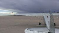 - N1748D alone on the ramp at KDHT in Dalhart, TX as a monster thunderstorm bears down on us from the west.  Good Samaritan and head mechanic, Chuck, at Larsen Aviation helped me get it into a hangar 20 minutes after this shot before the storm hit. - by boinsimi