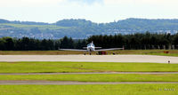  - Facing east at Dundee with one of the new Aquila training aircraft of Tayside Aviation carrying pre-flight checks. - by Clive Pattle
