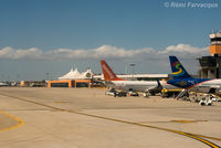  - View of main parking area in front of terminal building as taxiing for take-off. - by Remi Farvacque