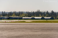  - View to southwest from main terminal building of private hangars. - by Remi Farvacque