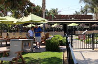  - The Waypoint Cafe and its patio tables. Eat indoors or out. I have eaten there since the 1980s. - by Doug Robertson