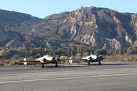  - A couple of twin Beech 18 variants. N5644D an E18S based at SZP & N15KK, a US Army Air Corps AT-11 bombing practice trainer side by side near SZP Helipad. Unusual to see two twin Beech 18 variants together here. See N15KK photos. - by Doug Robertson