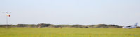  - Panoramic shot of the airfield at Blackpool EGNH - the sand dunes show its close proximity to the Irish Sea. - by Clive Pattle