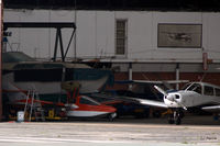  - Peek inside Hangar 2 on northside at Blackpool EGNH - On left can be seen rare Pereira Osprey II G-BVGI seaplane - by Clive Pattle