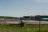  @ Fort Nelson Airport - View to south from northernmost portion of airport. Privater and corporate hangars. - by Remi Farvacque