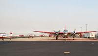  - Fire fighting aircraft on NIFC ramp at sunrise. - by Gerald Howard