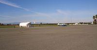  - Mooney 1DD seen as it taxied from the fuel island. View is to the NW. - by S B J