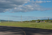  - View east of private parking / Tsayta Air offices. - by Remi Farvacque