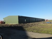  - Tibenham Airfield Cladding almost finished of the new purpose built glider Hangar - will allow storage of gliders either side - full sliding doors on both sides. - by Keith Sowter