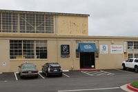  - Channel Islands Aviation work hangar. This hangar goes back to Oxnard Air Force Base here before Camarillo was a city. Federal GSA gave air base to Ventura County in 1976. USAF base closed 1971. Some USAF bldgs razed. Now new FAA tower. - by Doug Robertson