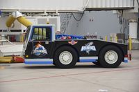  - One of Southwest's tugs painted for the local hockey team. - by Gerald Howard