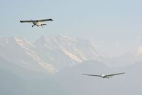  - Towing a glider out off LOWI, Innsbruck with the austrian alps in the background - by Paul H