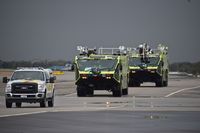  - ARFF Unit returning to quarters after answering call for an aircraft landing with gear problems. Aircraft landed safely. - by Gerald Howard