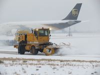  - Outside crews busy on a snow filled day. - by Gerald Howard
