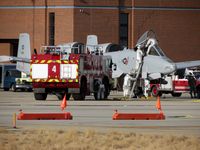  - Idaho ANG fire fighter practice a rescue on an A-10 pilot. - by Gerald Howard