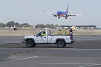  - Outside maintenance crews spraying to keep the weeds at bay. A never ending job. - by Gerald Howard