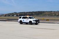  - Airport Roving Patrol vehicles serve airfield security. AOPA FLY-IN attracts a large number of visiting aircraft/members to many simultaneous seminars and added spectators - by Doug Robertson