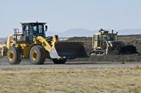  - Rotomill (chewed up taxiways & runways) stored for use on other parts of the airport. - by Gerald Howard